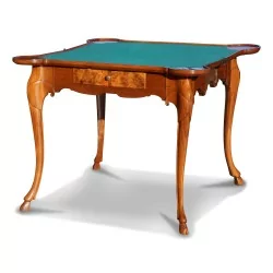 A walnut games table with a "checkerboard" marquetry top and curved legs. Berne.